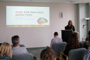 faculty member delivering a grand rounds lecture