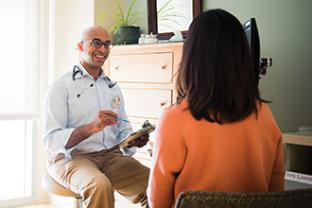 Patient and practitioner talking
