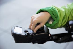 Hand on wheelchair control 