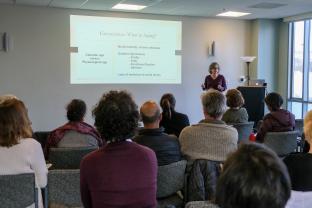 Faculty presenter speaks to an audience about Integrative Medicine and Aging