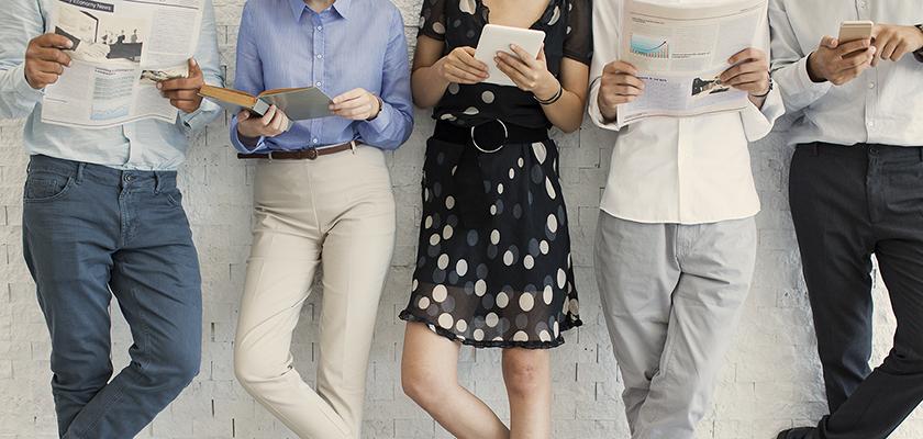 People reading papers and phones