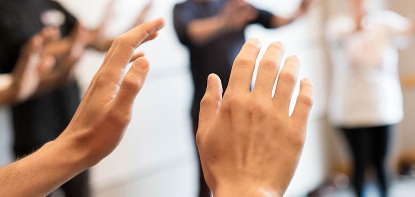 Group with hands held out