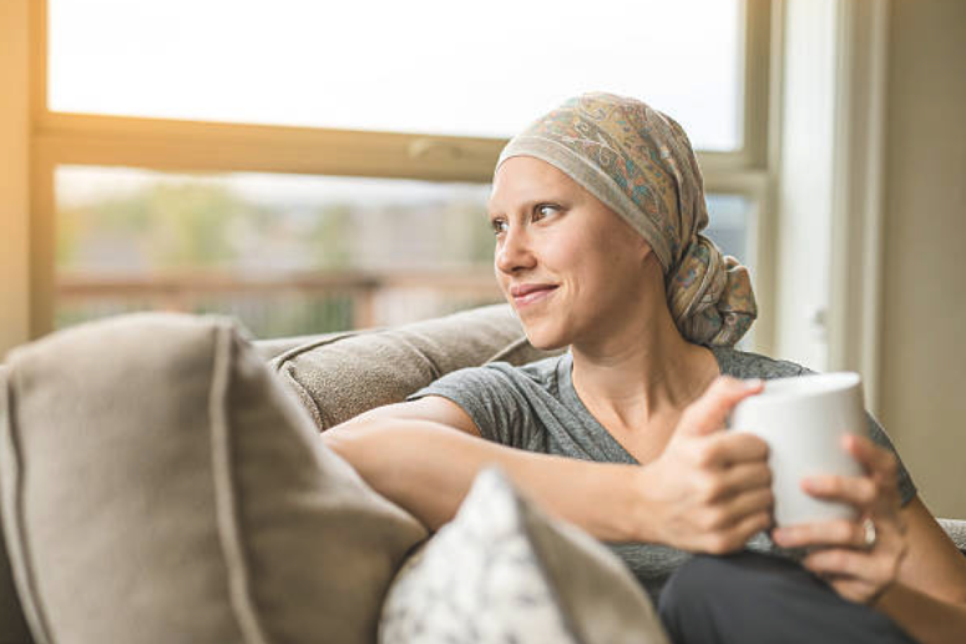 Woman in head wrap with tea